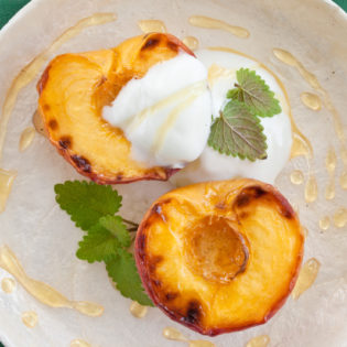 Honey Roasted Peaches with Spirit of St. Supéry Brandy Whipped Cream