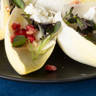Endive, Watercress, and Fennel Salad with Goat Cheese and Pomegranate Seeds
